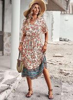 Midi Jurk met Bloemenprint en Hoge-Lage Zoom - Midi Dresses - Jurkjes.co