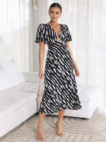 Midi Jurk met V-hals en Abstracte Print - Midi Dresses - Jurkjes.co