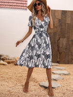 Midi Jurk met V-hals en Bladerenprint - Midi Dresses - Jurkjes.co