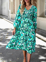 Midi Jurk met V-hals en Bloemenprint - Group3 - Jurkjes.co